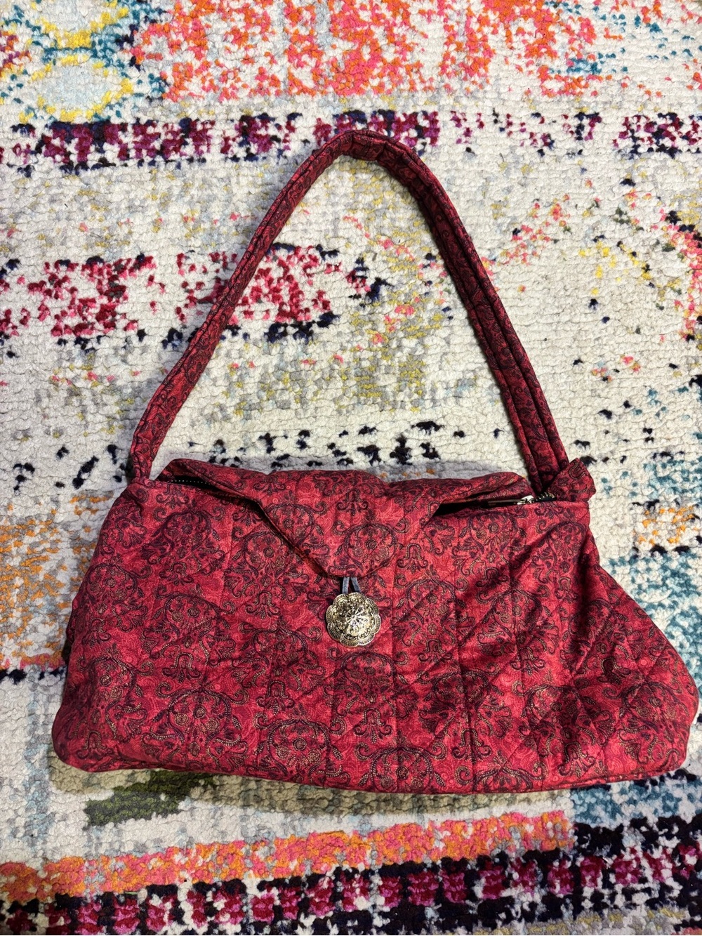 Quilted Red Pattern Shoulder Bag with Decorative Medallion